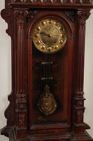 Sold at Auction: GERMAN WALL CLOCK MARKED D.R.P. (DEUTSCHES REICH PATENT) - Walnut case with broken arch pediment and full Corinthian columns either...