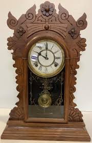 Lot - Waterbury walnut Victorian gingerbread clock, 22.5”H