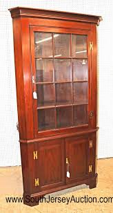 Sold at Auction: Henkel Harris Furniture Virginia Galleries 12 pane SOLID mahogany corner cabinet with keys
