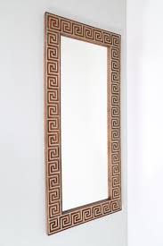 Wood and brass wall mirror, 50's. | Manifattura Italiana
