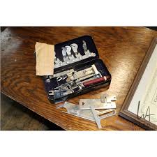 Antique Reliance treadle sewing machine in iron and oak cabinet plus a mid 20th century floor standi