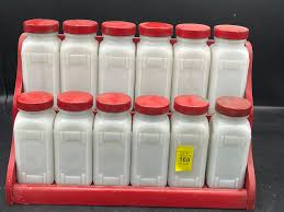 Lot - Vintage milk glass spice containers and wooden stand