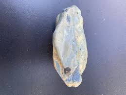 What type of rock has blue color and craters?