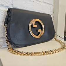 Gucci Shoulder Bag: Gold GG Logo