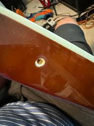 How to fix a strap peg on a guitar?