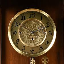 Lot - AN ANTIQUE BRASS AND CARVED WALNUT REGULATOR WALL CLOCK, POSSIBLY AUSTRIAN, LATE 19TH CENTURY,