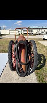 Antique fire extinguisher on wheels