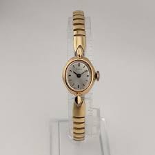 Timex Women's Gold Tone Watch, Oval Dial, Stretch Strap - I ...
