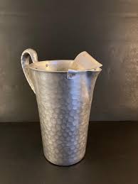 LOT 200J: Hammered Aluminum Collection - Club Cookware, Hand Forged Everlast Metal, Farberware with Vintage Cook Books | EstateSales.org