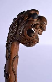 An Early 20th Century South East Asian Carved Wood Dragon Walking Cane Smothered In Motifs. 85 Cm Lo
