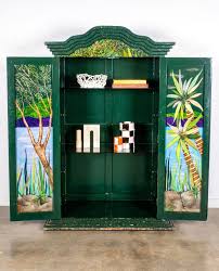 For those of you who had been eyeing this very special piece - this is your sign. The hand-painted cabinet hailing from Mexico is a truly spectacular display of functional art, and