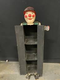 Sold at Auction: Antique Handmade Folk Art Clown Storage Cabinet