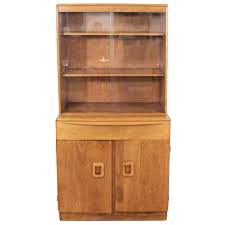 Mid-Century Modern China Cabinet Heywood Wakefield Champagne 2-Piece Cabinet For Sale at 1stDibs | heywood wakefield china cabinet, heywood wakefield china hutch, heywood wakefield hutch cabinet
