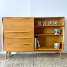 Gor-Geous! Heywood Wakefield wall unit. It's a 13” deep cabinet with drawers, shelves, and drop front secretary desk/bar. We've taken to calling it the “one and done” because it's the perfect single