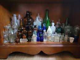 My curated bottle shelf from 4 years of digging at college ...