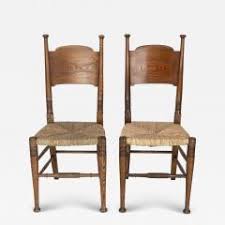 William Birch Ltd. - William Birch for Liberty & Co. A Pair of Arts & Crafts Rush Seat Oak Chairs