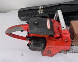 Sold at Auction: VINTAGE HOMELITE XL12 CHAINSAW