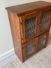 Small oak cabinet – Good Behavior