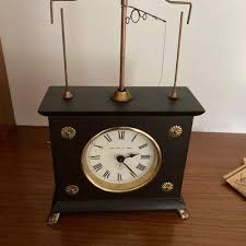 Lot#7 Jerome & Co flying ball clock | EstateSales.org