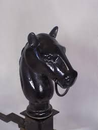Sold at Auction: Antique cast iron horse head andirons