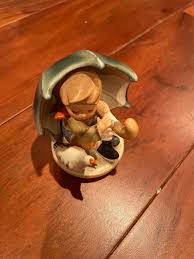VINTAGE BOY WITH UMBRELLA FIGURINE | Mercari