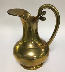 Sold at Auction: Brass Pitcher