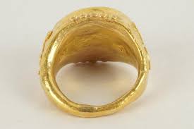 Lot - 18 KARAT YELLOW GOLD SIGNET RING