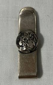 Silver tone money clip with side image of the | Mercari