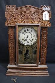 Sold at Auction: Great carved Ingraham mantle clock