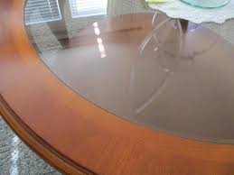 Sold at Auction: GLASS TOP ROUND WOOD COFFEE TABLE