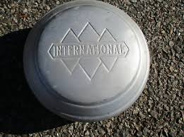 One older factory silver International dog dish hubcap ...