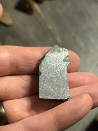 As the main rock sits protected by my orange meteorite gaurd cat, a small piece has been taken off and polished out, any guesses on the class? Definitely a highly shocked /