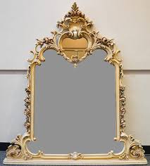Lot - Silik Italian Rococo Style Enamel and Parcel Gilt Decorated Mirror, 60 x 51 in. (152.4 x 129.5 cm.)