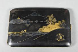 Sold at Auction: A 20th century Japanese Komai style damascene cigarette case, burnished steel decorated with a Fuji