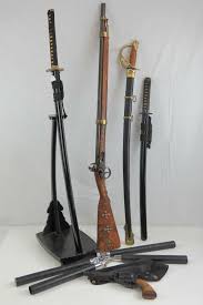 Sold at Auction: Two contemporary Japanese swords, one with stand, together with a reproduction cavalry sword,