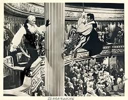 Photograph of actors Mel Ferrer and Stewart Granger in the 1952 MGM film 'Scaramouche' (signed and inscribed by Stewart Granger to a friend): (1952) Inscribed by Author(s) Photograph | Randall's Books