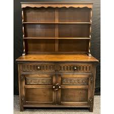 A Jaycee oak dresser, plate rack top with shaped cornice ...