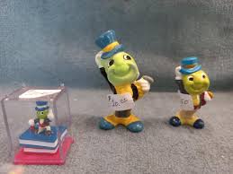 Sold at Auction: Pinocchio and Jiminy Cricket Ceramics and toys