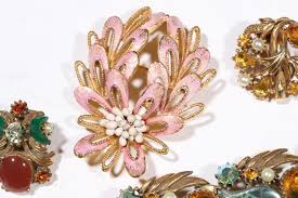 Sold at Auction: Vintage Florenza jewelry group with bracelets, brooches, lapel pin watch, and earrings. 7 1/8"L x 1 3/8"W (pink glass bracelet)