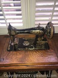 Antique Singer Treadle Sewing Machine in Tiger Oak Cabinet Auction | Gleaton's, Metro Atlanta Auction Company, Estate Sale & Business Marketplace