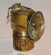 Sold at Auction: ANTIQUE BRASS AREAMLINED JUSTRIGHT CARBIDE MINER'S LAMP