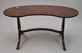 Sold at Auction: Occasional Table, Beacon Hill Collection, Kidney Shape with Leather Insert Top, Stretcher Base Leads to Splayed Legs, 21 1/2"h x 41"w (some scratches on leather)