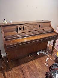 We have a Kimball standing piano that we are giving away ...