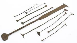 Four Wrought Iron Pieces Including African.