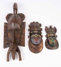 Sold at Auction: Lot of 3 Carved Wood African Masks.