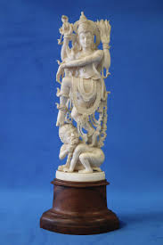 Sold at Auction: FINE HAND CARVED STATUE, DEPICTING A HINDU GODDESS WITH SNAKE, STANDING ON MONKEY BOY, NON COMPOSITE ON WOODEN STAND - 230MM FIGURE,