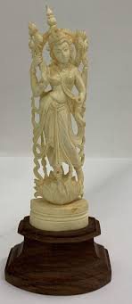 Sold at Auction: Oriental Bone Carved Figurine On Wooden Stand