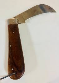 Sold at Auction: Vintage knife single blade/wood handle