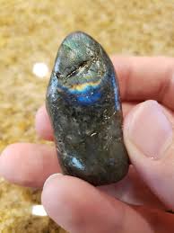 From a bag of Madagascar rocks for tumbling. Is this labradorite? My son hopes it is opal. : r/whatsthisrock