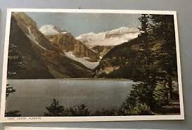 3 VINTAGE LAKE LOUISE POSTCARDS IN FOLDER UNPOSTED BYRON HARMON PHOTOGRAPHS | eBay
